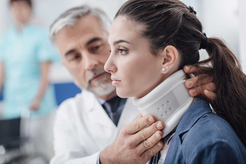 doctor visits girl with neck collar