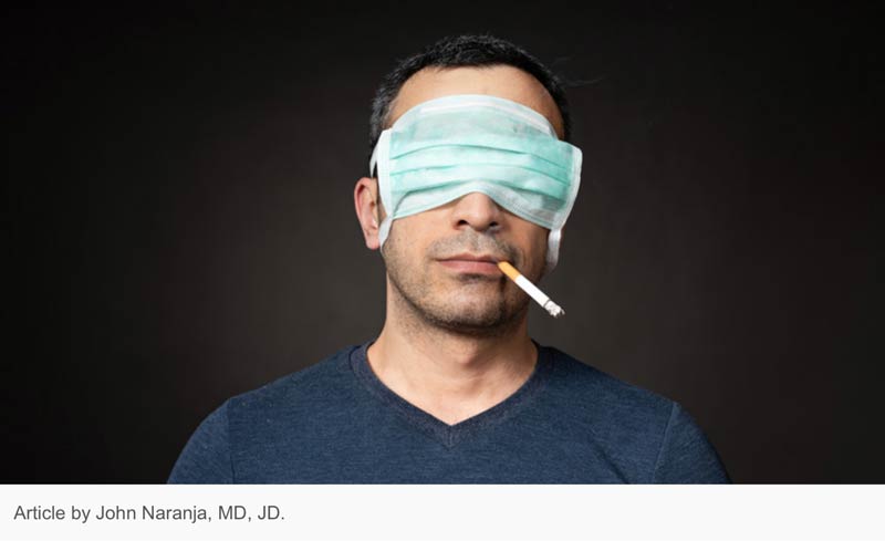 COVID-19 and smoking - cigarette in mouth, facemark coving eyes in denial" - Article by John Naranja, MD, JD.