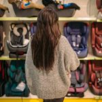mother trying to decide the best car seat for her child