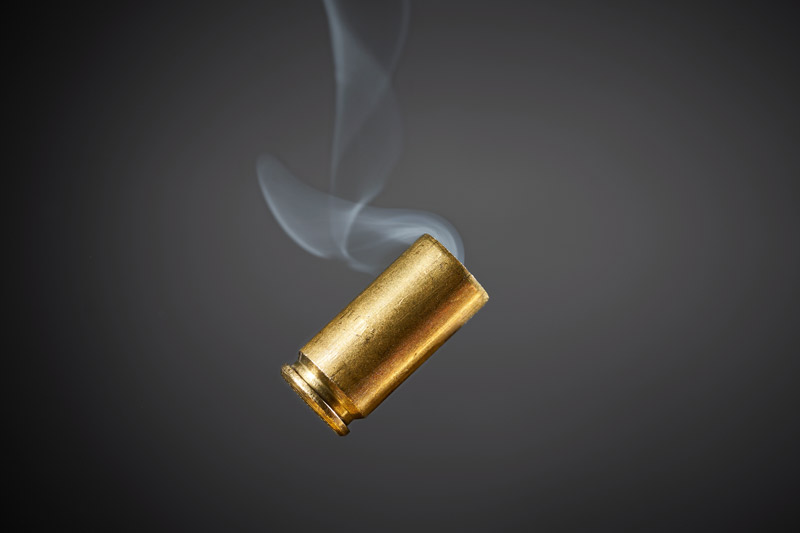 smoking bullet casing tumbling