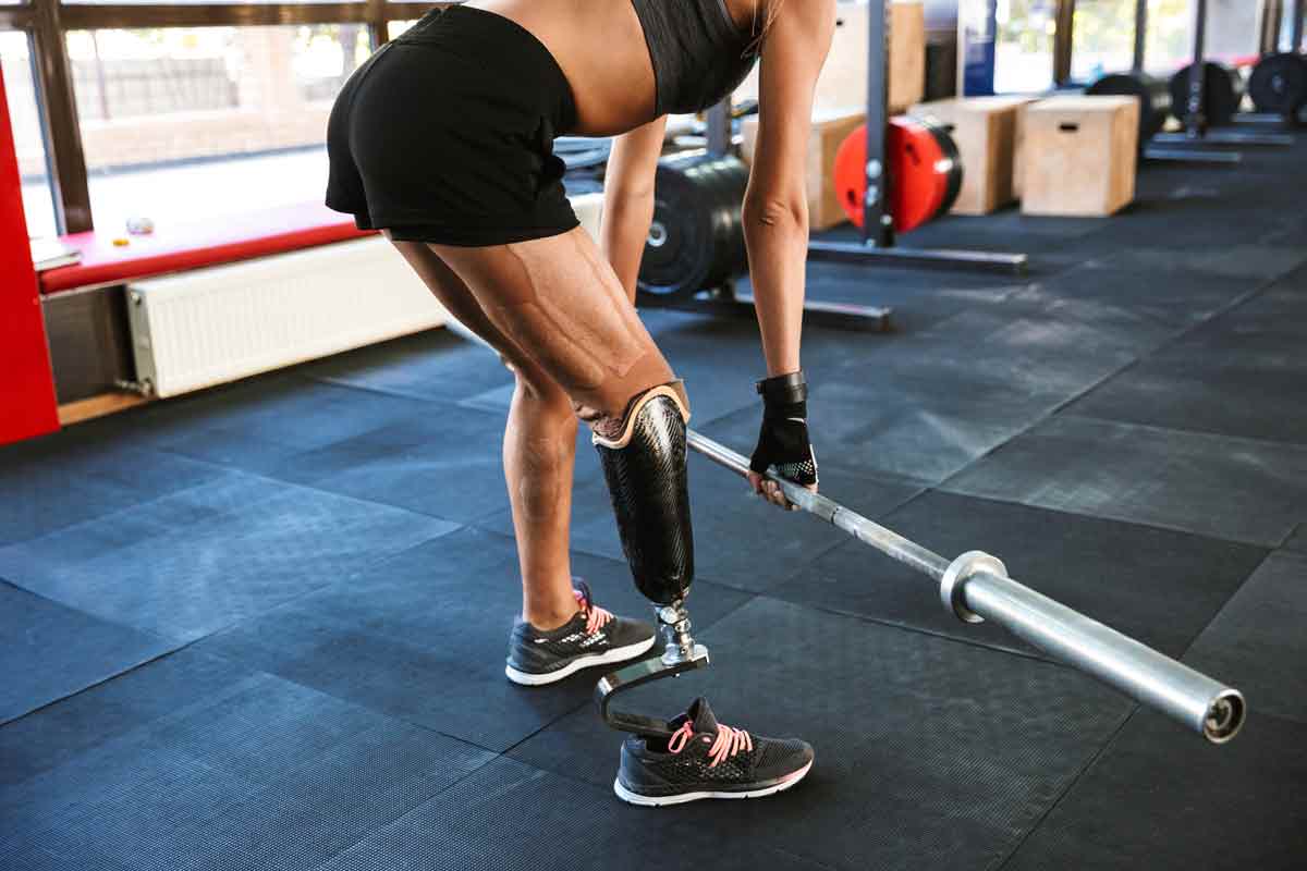 strong disabled sports women exercising in gym