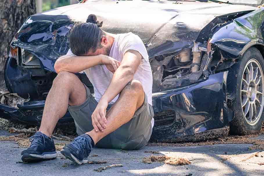 teenage boy laments losses from car crash